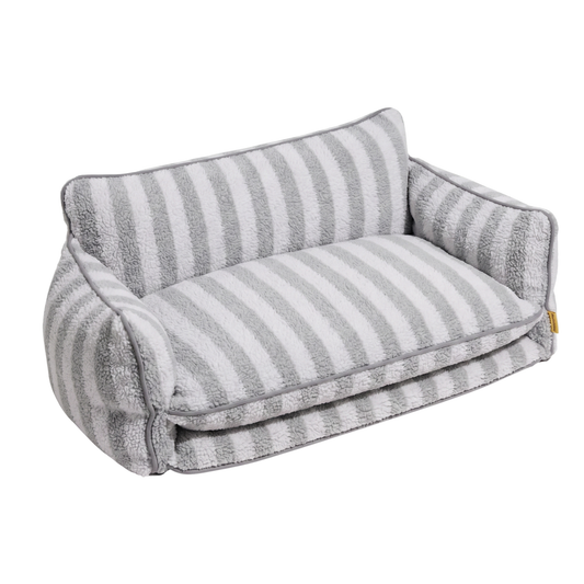 Grey and white striped couch style dog bed with cushioned interior and supportive side walls for pets